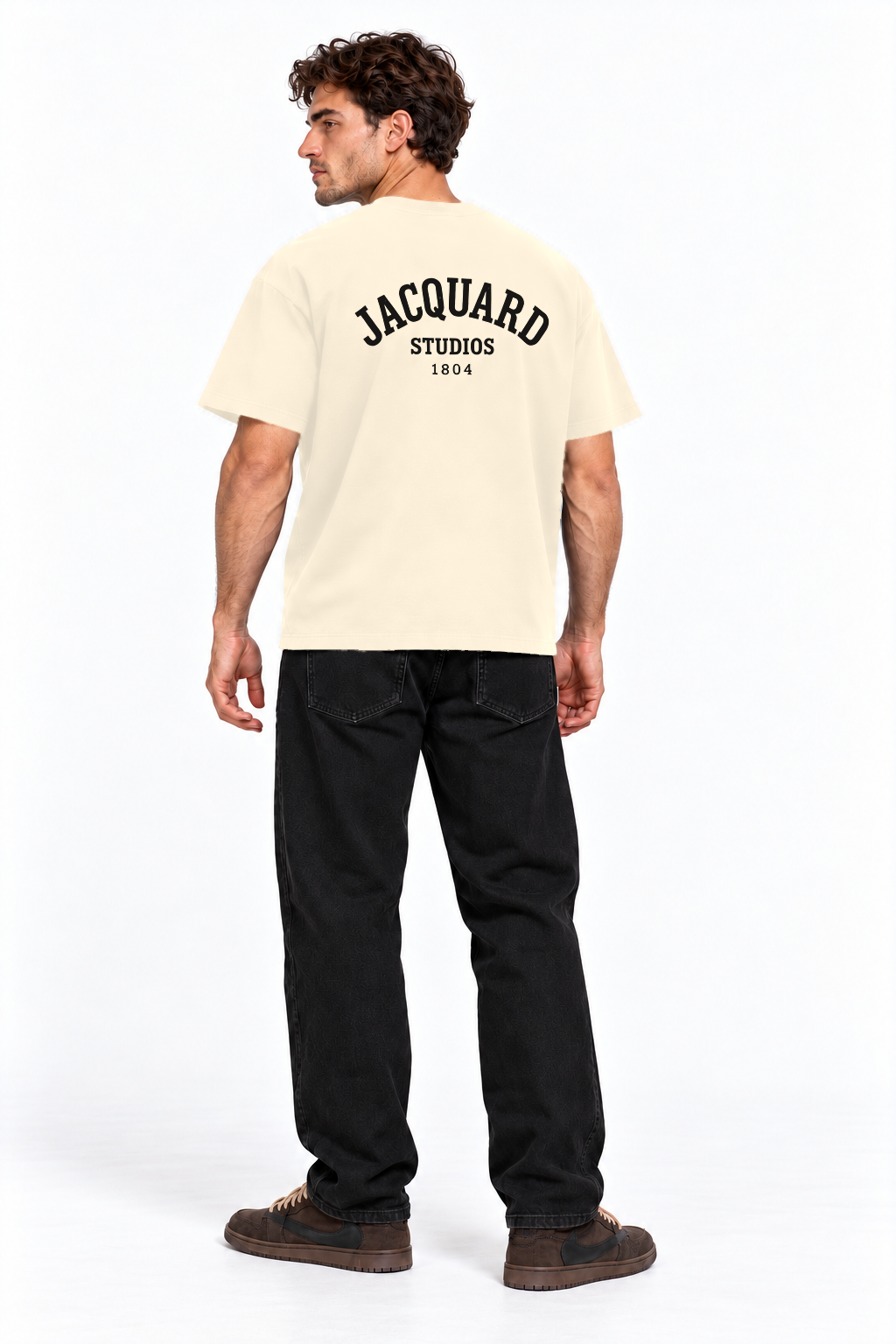 Back view of a model wearing the JacquardStudios 1804 T-Shirt in Apricot