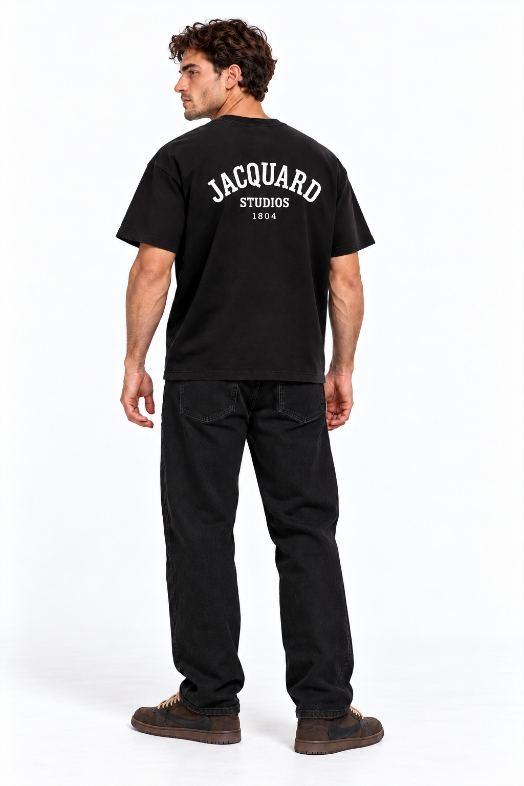 Back view of a model wearing the JacquardStudios 1804 T-Shirt in Black