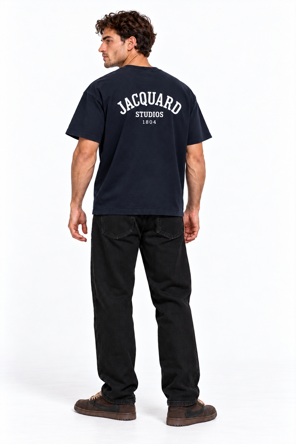Back view of a model wearing the JacquardStudios 1804 T-Shirt in Navy Blue