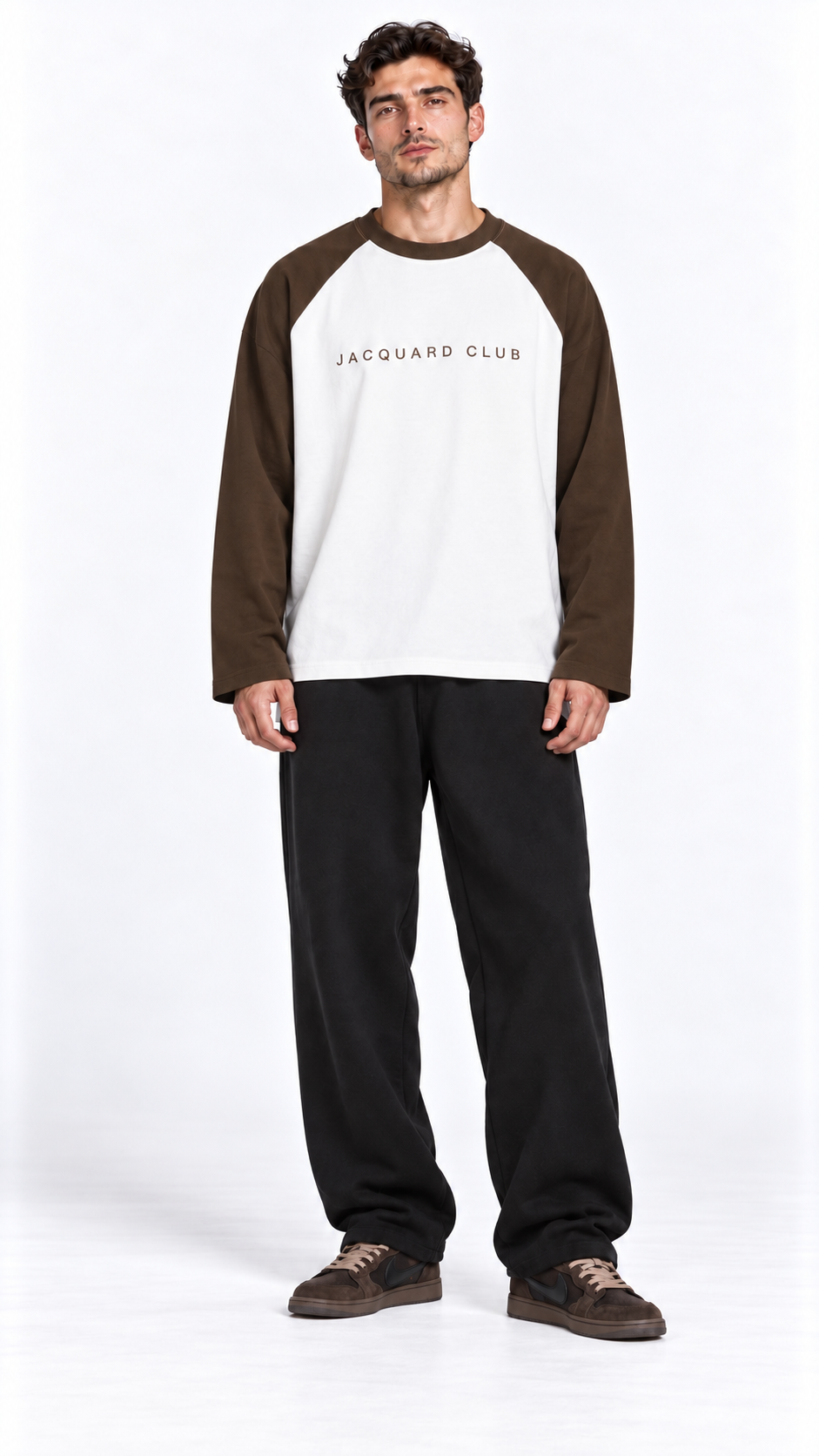 Front view of a model wearing the JacquardStudios Club Raglan Longsleeve in White with Coffee