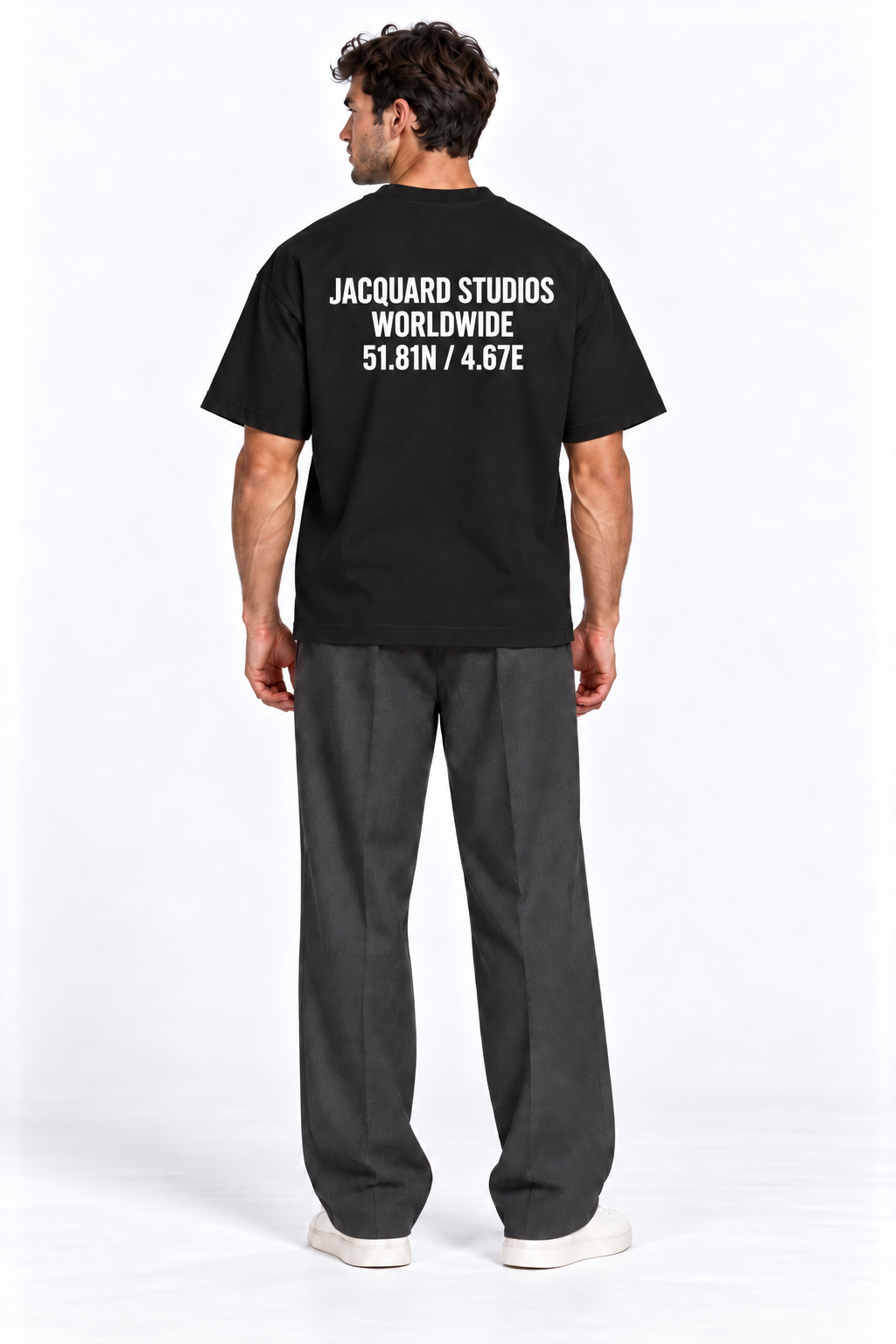 Back view of a model wearing the JacquardStudios Coordinates T-Shirt in Black
