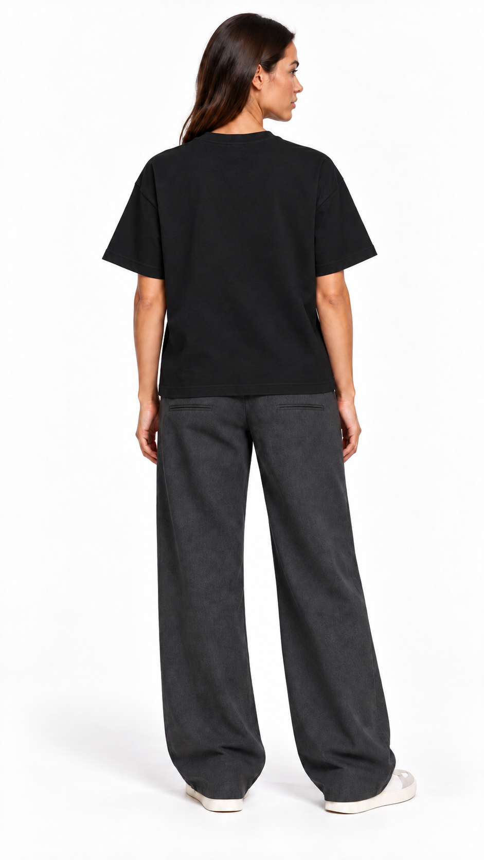 Back view of a second model wearing the JacquardStudios Defined by T-Shirt in Black