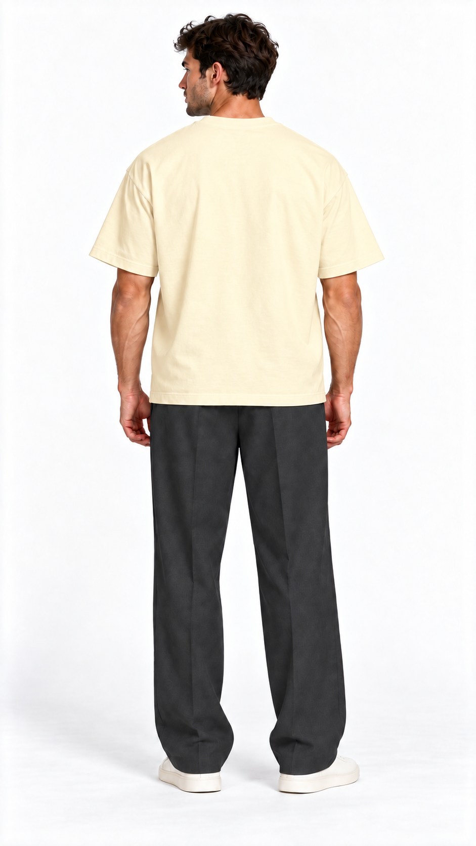 Back view of a model wearing the JacquardStudios Defined by T-Shirt in Apricot