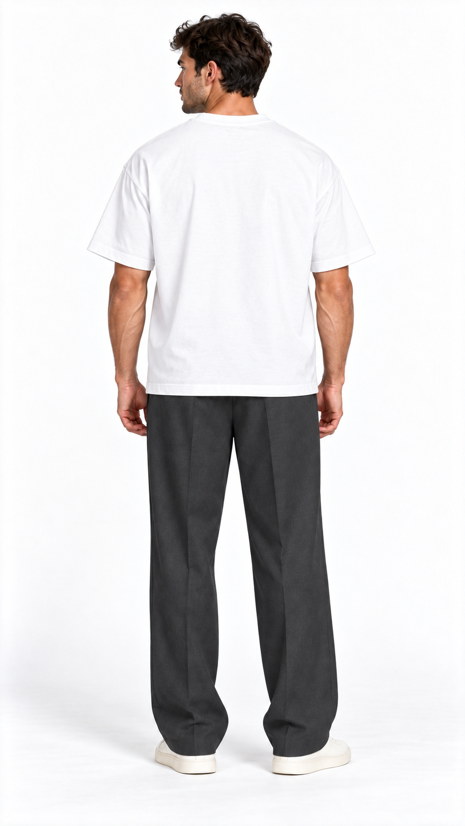 Back view of a model wearing the JacquardStudios Defined by T-Shirt in White
