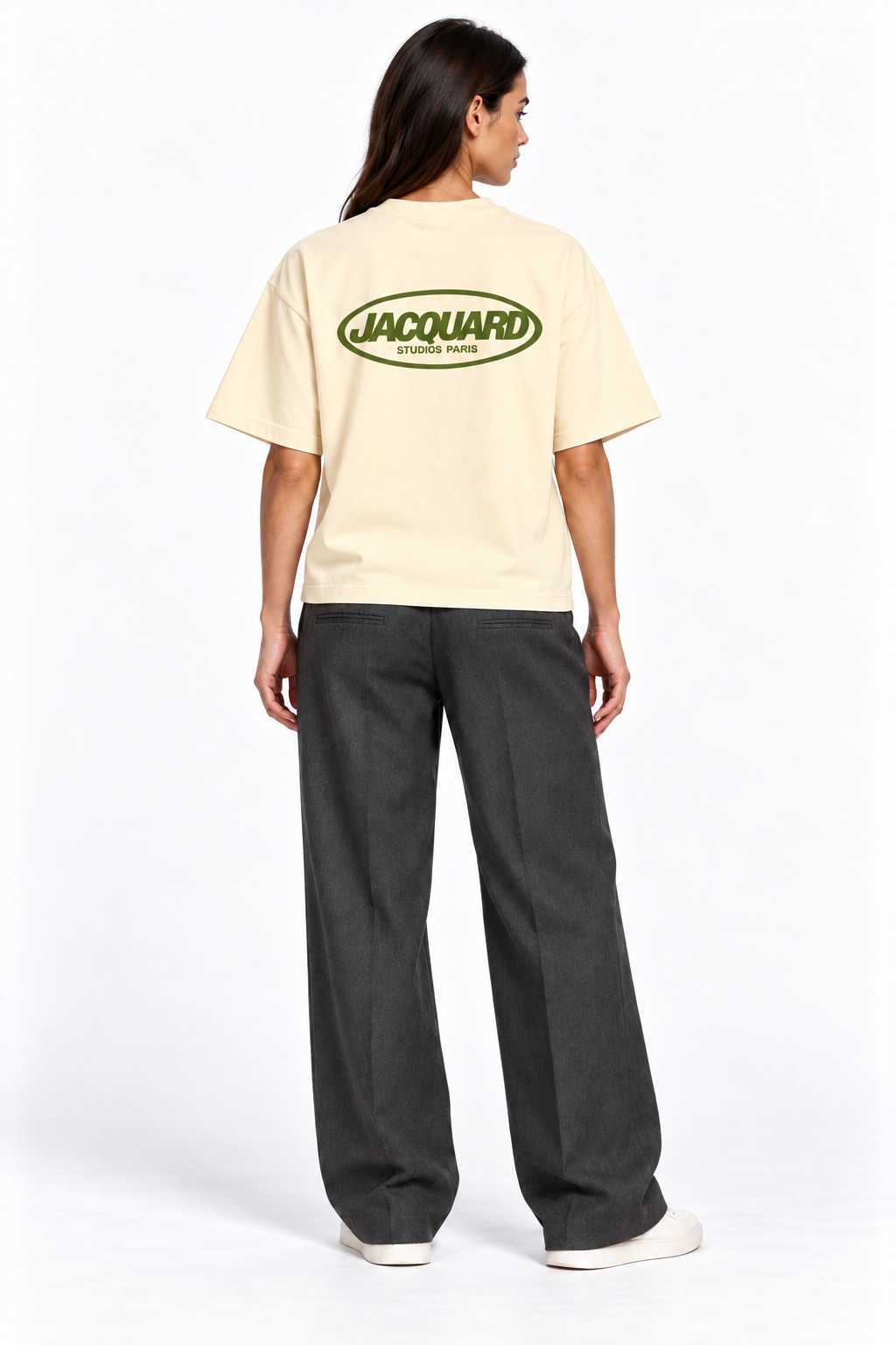Back view of a second model wearing the JacquardStudios Logo T-Shirt in Apricot