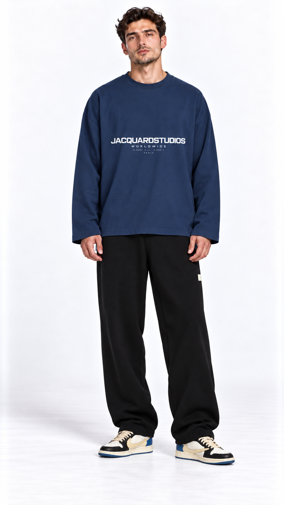 Front view of a model wearing the JacquardStudios Worldwide Longsleeve in Navy Blue