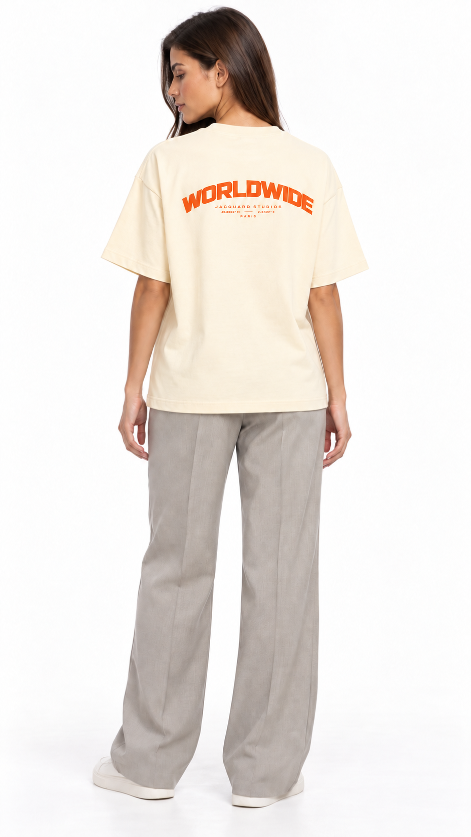 Back view of a second model wearing the JacquardStudios Worldwide Orange T-Shirt in Apricot