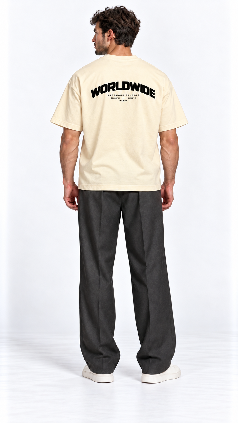 Back view of a model wearing the JacquardStudios Worldwide T-Shirt in Apricot