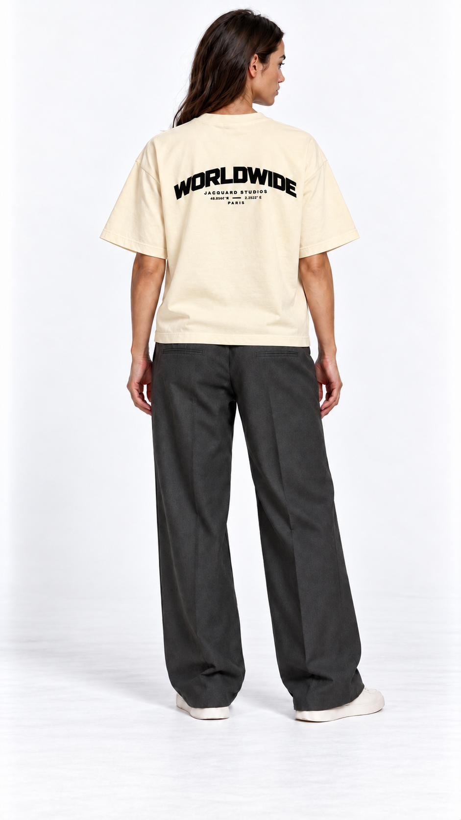 Back view of a second model wearing the JacquardStudios Worldwide T-Shirt in Apricot